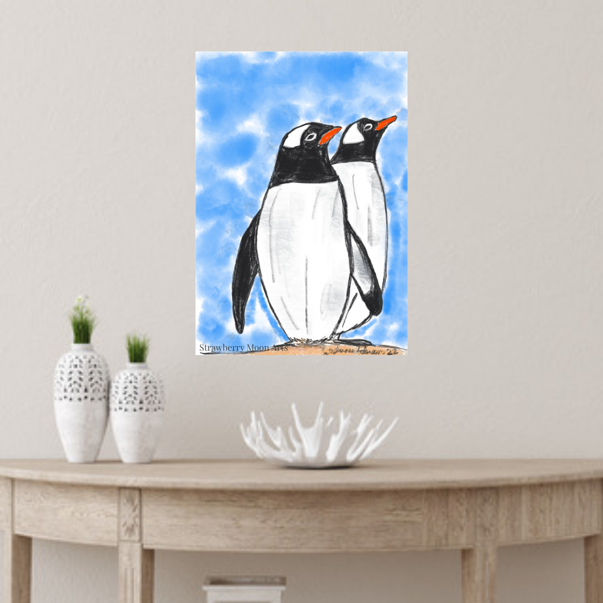 Penguins poster by Stephanie Anderson above a console table